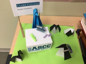 origami penguins gather around an ASCC table