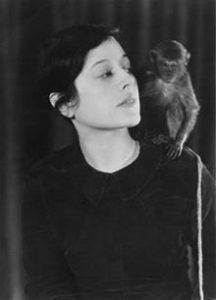 Photo of Emily Hahn with a friendly monkey on her shoulder