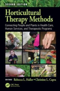 Book cover showing people working with plants 