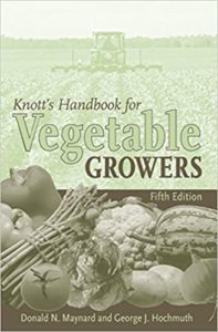 Book cover showing fruits and vegetables and harvesting equipment