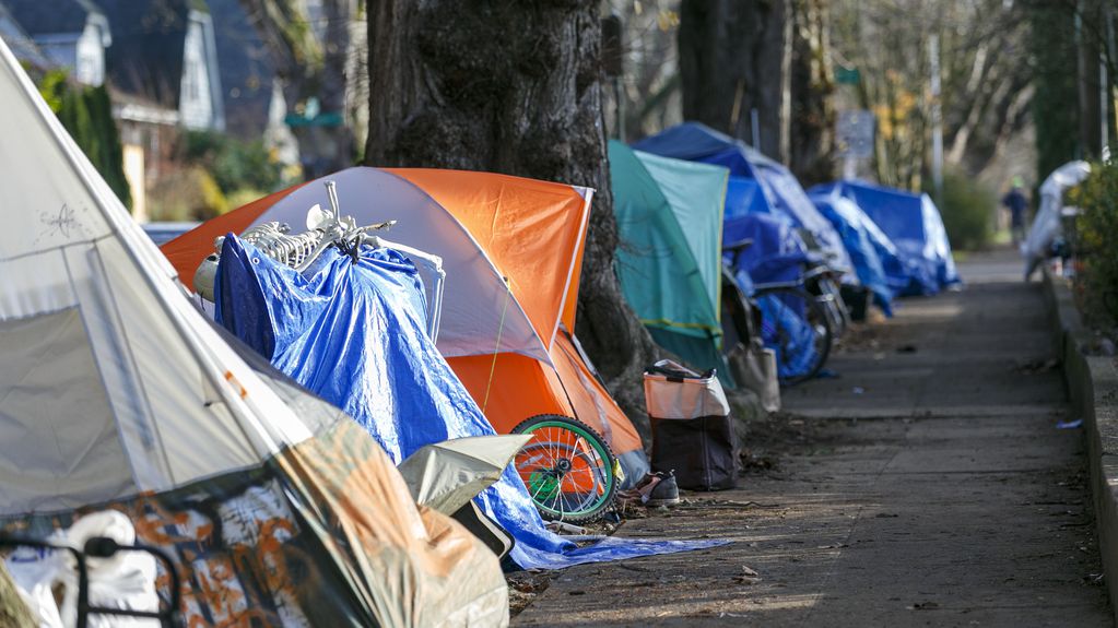 A photograph of a tent city on a sidewalk in Portland.