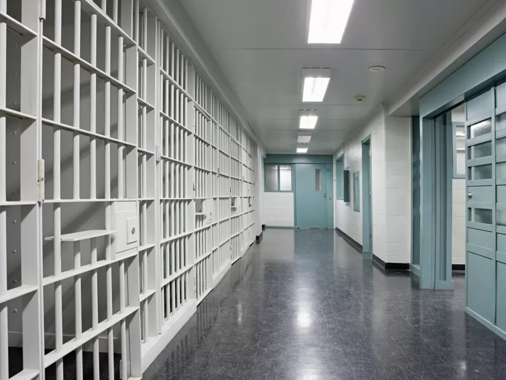 A photograph of a prison hallway.