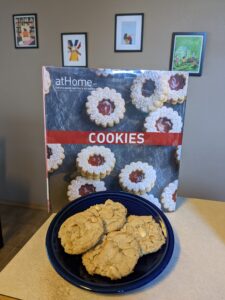 At Home Cookies cookbook and peanut butter cookies on a plate
