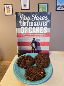 United States of Cakes cookbook and chocolate cookies on a plate