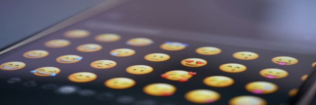Close-up photo of a selection of emoji on an iPhone.